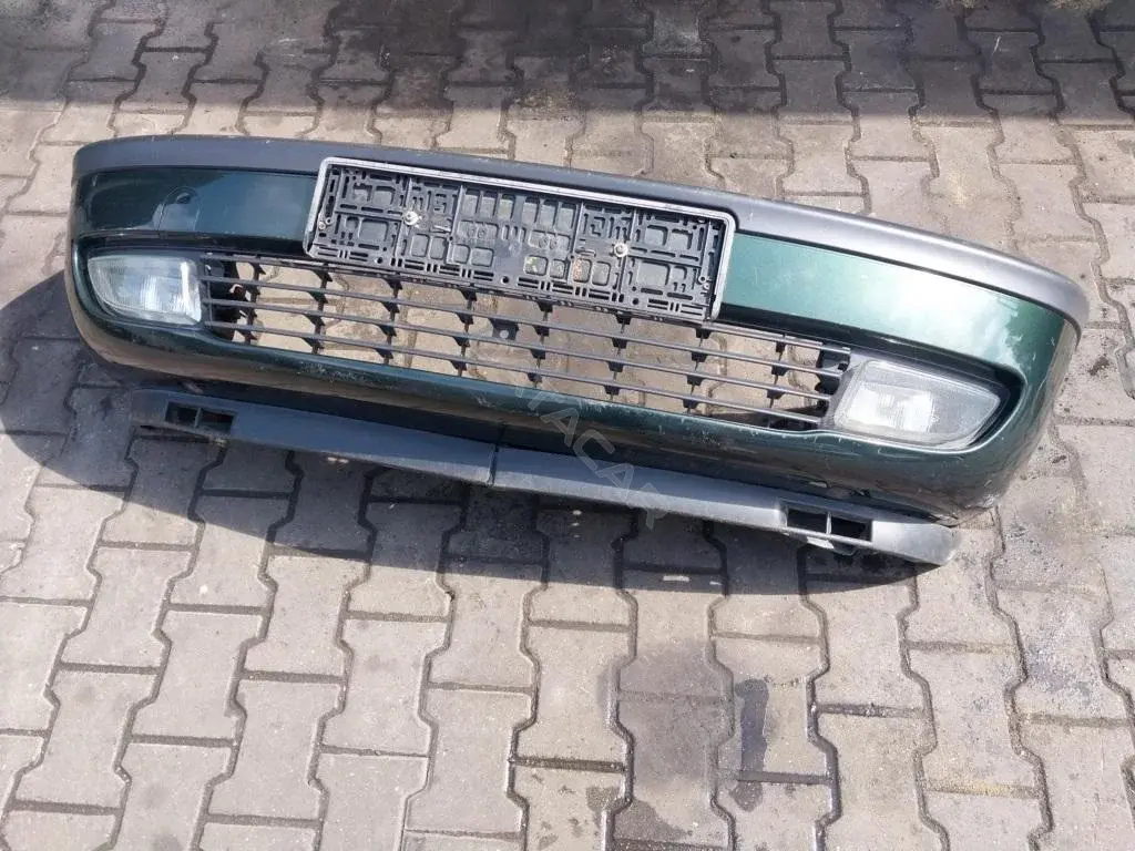 Передний бампер 90580620
