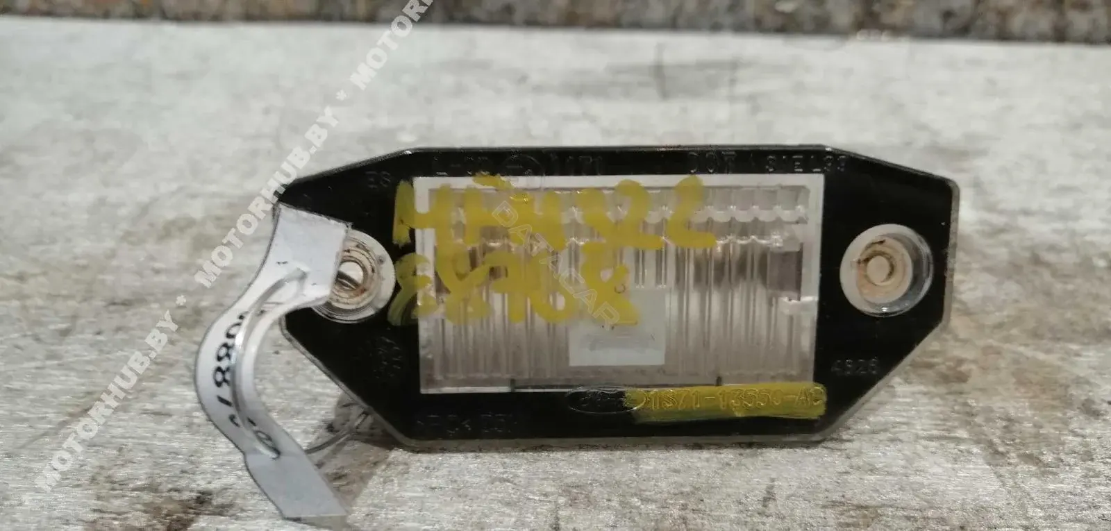 Фонарь подсветки номерного знака 1S7113550AC