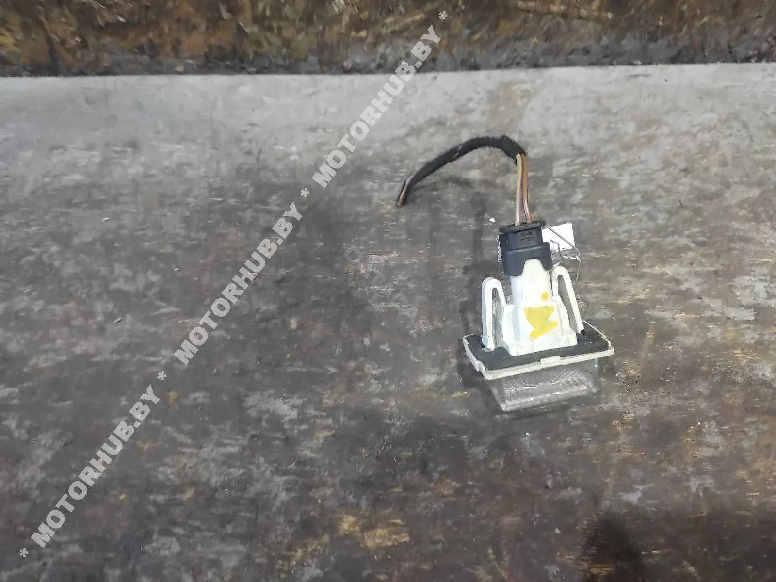Фонарь подсветки номерного знака A2218200856
