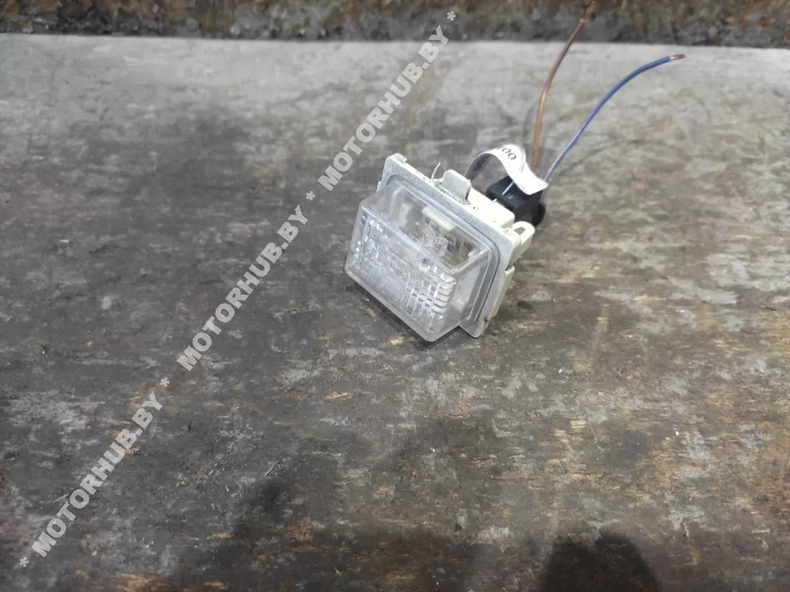Фонарь подсветки номерного знака A2218200856
