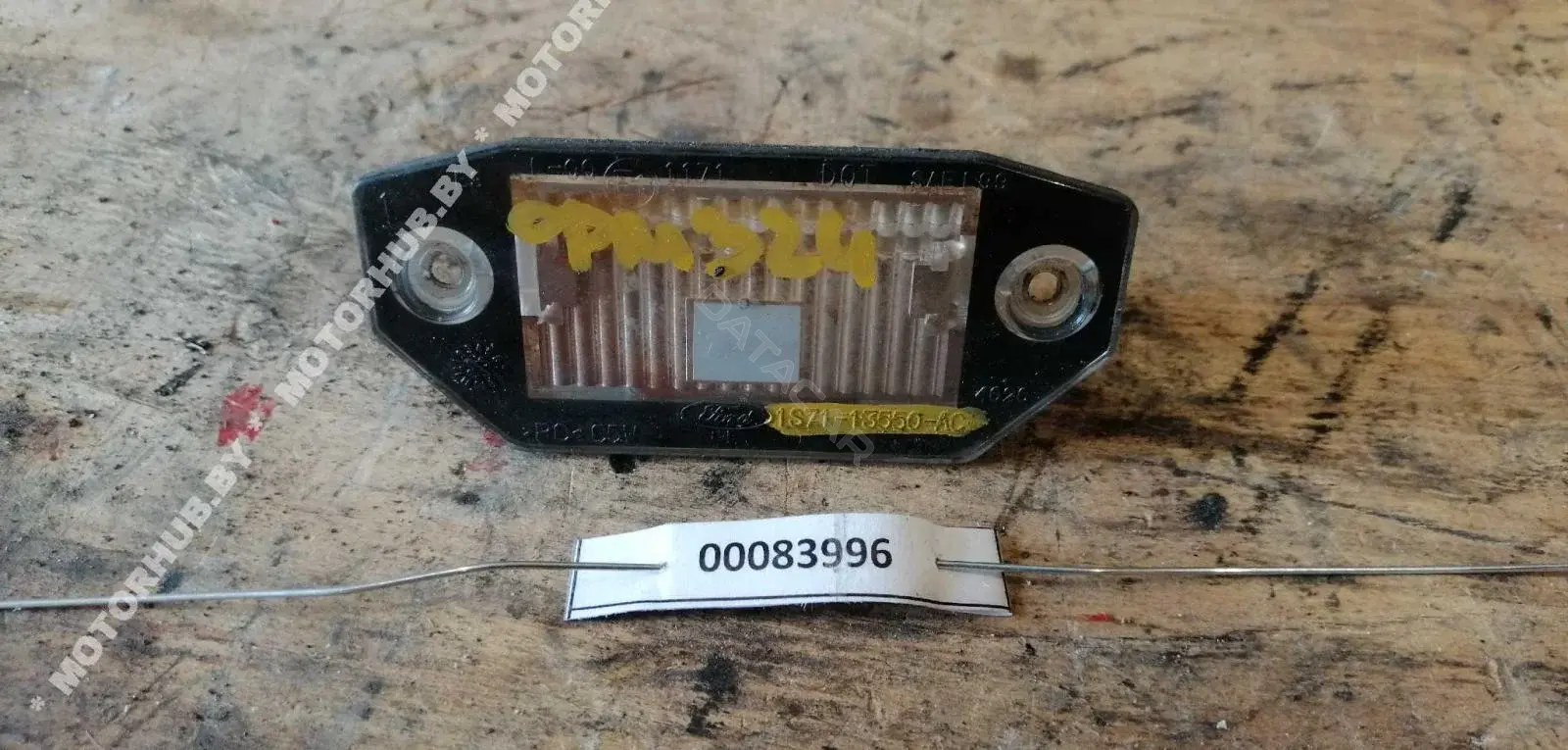 Фонарь подсветки номерного знака 1S7113550AC