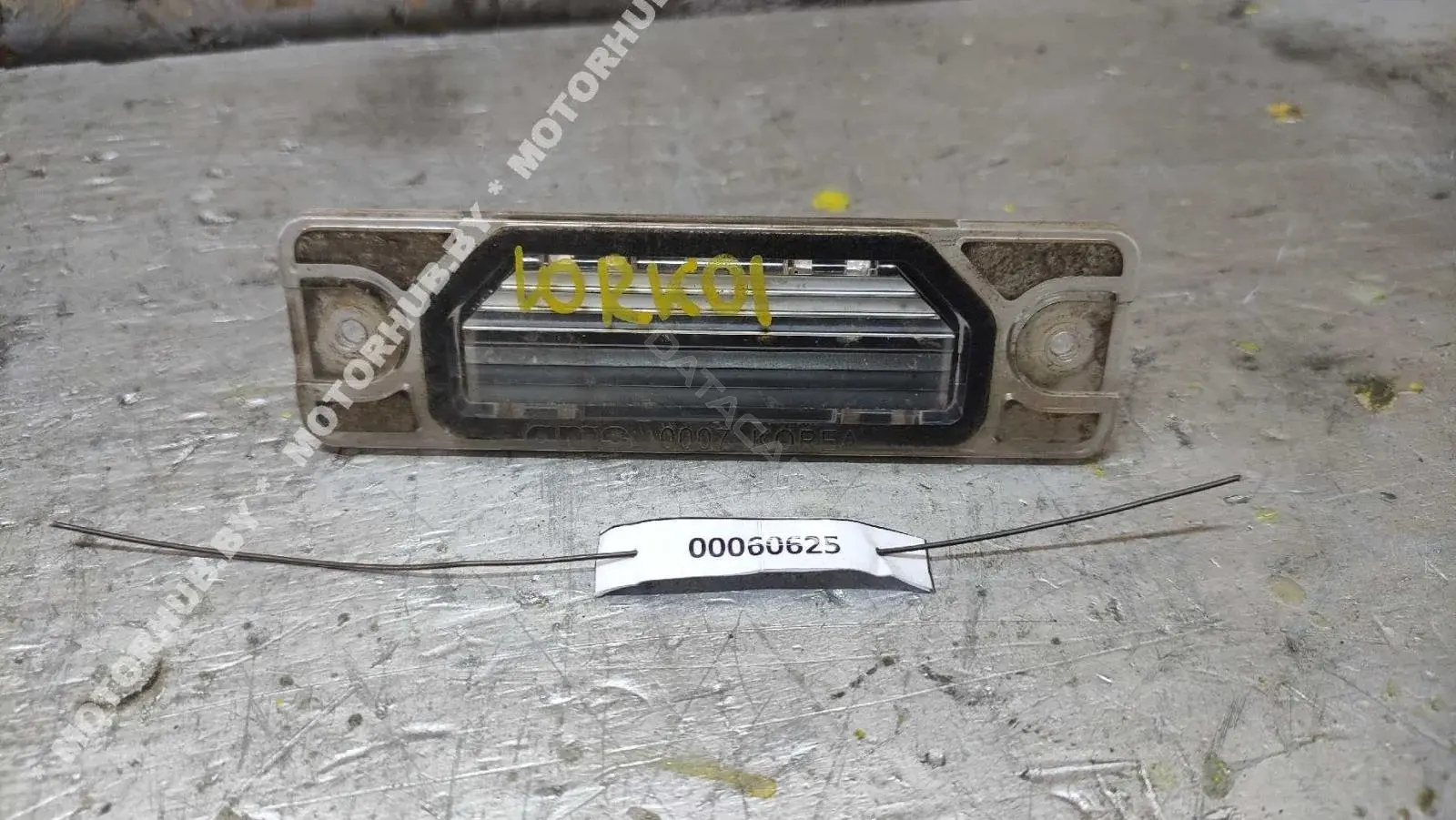 Фонарь подсветки номерного знака 26510JY00A