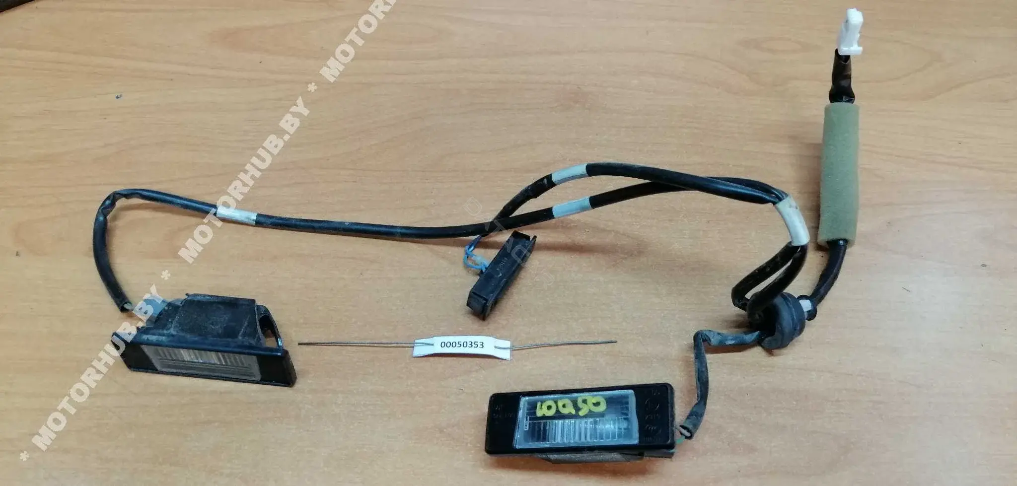 Фонарь подсветки номерного знака 00050353_1