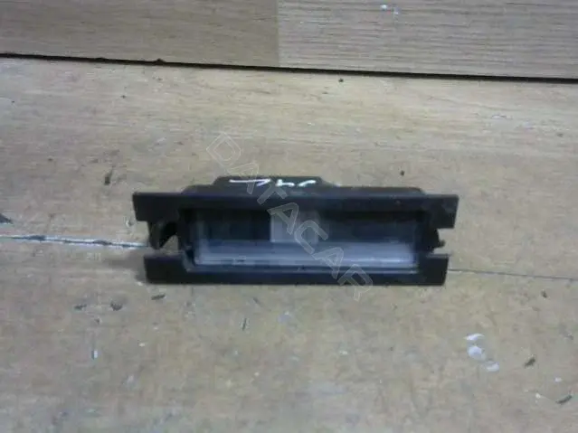 Фонарь подсветки номерного знака MR957364