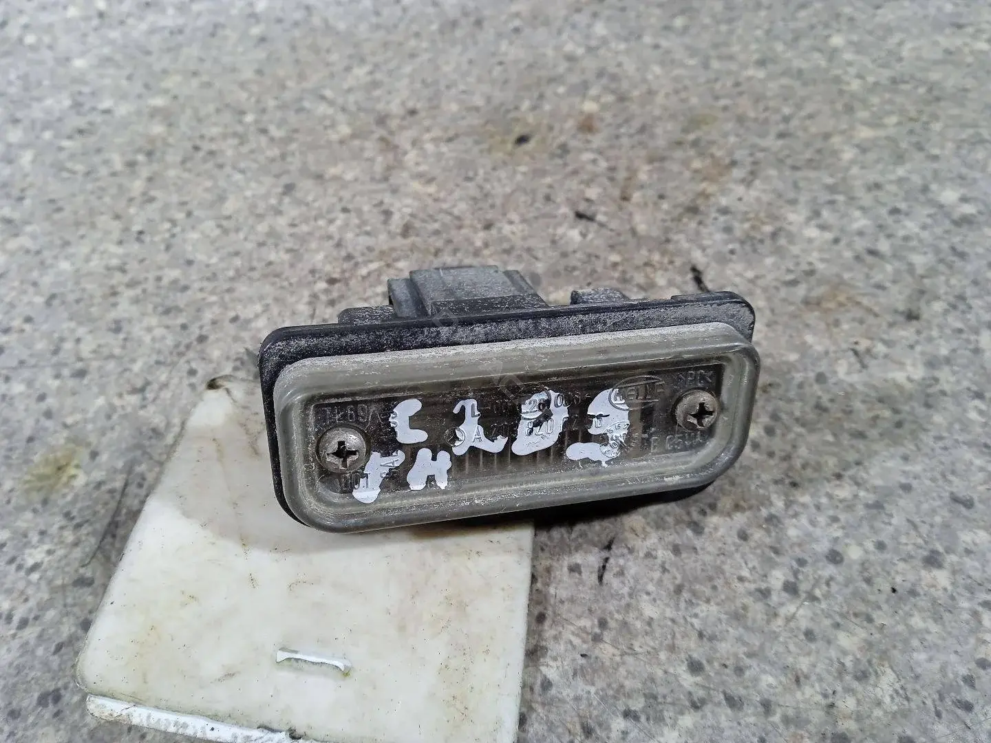 Фонарь подсветки номерного знака 46023016163