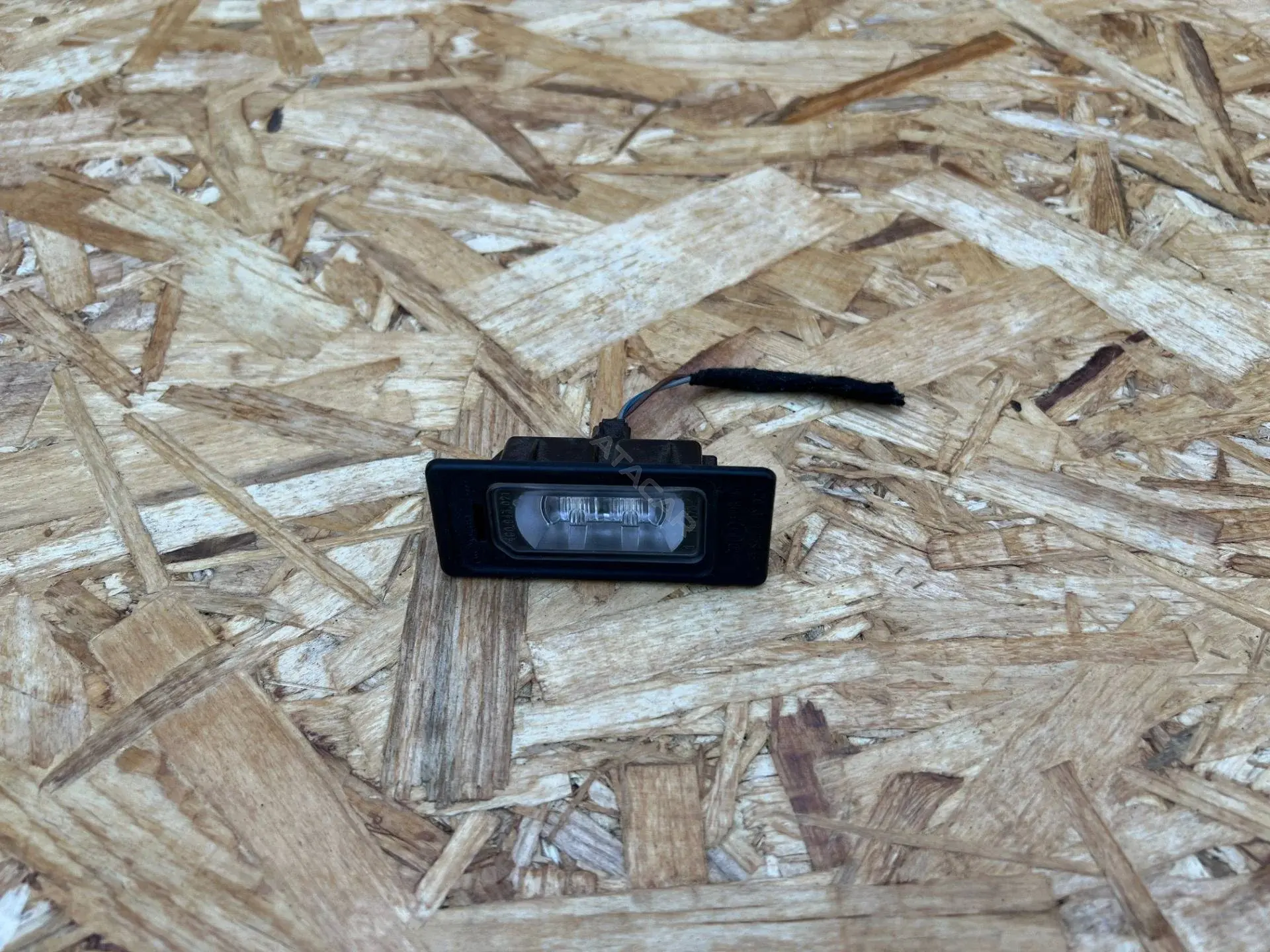 Фонарь подсветки номерного знака 4G0943021